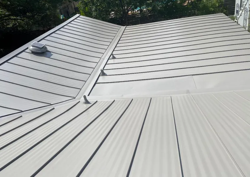 Solar attic fan installed on a metal roof for Roof Ventilation in North Brunswick